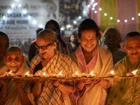 Elderly women at Pramod Talukdar Memorial Old Age Home light Diya oil lamps as they celebrate Diwali in Guwahati, India, on November 1, 2024...