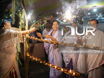 Elderly women at Pramod Talukdar Memorial Old Age Home burn sparkler crackers as they celebrate Diwali in Guwahati, India, on November 1, 20...