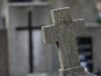 A tombstone in the form of a cross stands at the Rakowicki Cemetery during preparations for All Saints' Day in Krakow, Poland, on October 30...