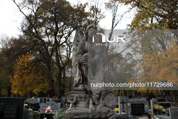 A tombstone in the form of a sculpture is at the Rakowicki Cemetery during preparations for All Saints' Day in Krakow, Poland, on October 30...