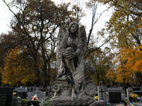 A tombstone in the form of a sculpture is at the Rakowicki Cemetery during preparations for All Saints' Day in Krakow, Poland, on October 30...