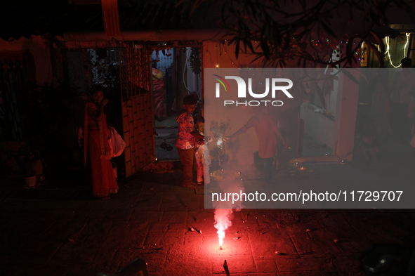 Children play with firecrackers during Diwali, the Hindu festival of lights, in Mumbai, India, on November 1, 2024. 