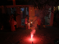 Children play with firecrackers during Diwali, the Hindu festival of lights, in Mumbai, India, on November 1, 2024. (