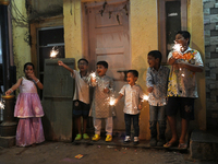 Children play with firecrackers during Diwali, the Hindu festival of lights, in Mumbai, India, on November 1, 2024. (