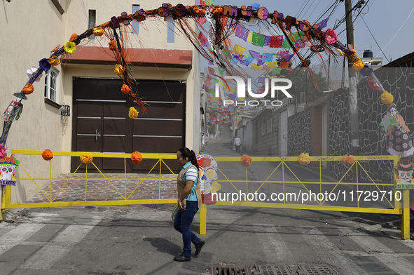 A view of an arch in Santiago Zapotitlan, Tlahuac, in Mexico City, on November 1, 2024, leads towards the community cemetery where dozens of...