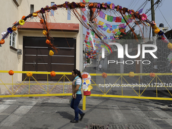 A view of an arch in Santiago Zapotitlan, Tlahuac, in Mexico City, on November 1, 2024, leads towards the community cemetery where dozens of...