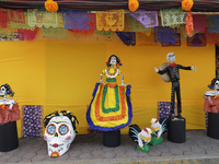 Residents of Santiago Zapotitlan in Mexico City, Mexico, on November 1, 2024, decorate their homes with cardboard skulls. They go to the com...