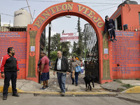 The entrance to the old pantheon of Santiago Zapotitlan in Mexico City, Mexico, on November 1, 2024, where inhabitants decorate the graves o...