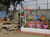 Residents of Santiago Zapotitlan in Mexico City, Mexico, on November 1, 2024, attend the old cemetery to decorate the graves of their deceas...