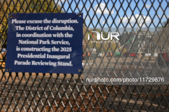 Construction crews work to build the 2025 Presidential Inaugural Parade Reviewing Stand on Pennsylvania Avenue outside of the White House in...