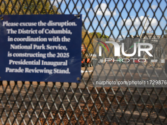 Construction crews work to build the 2025 Presidential Inaugural Parade Reviewing Stand on Pennsylvania Avenue outside of the White House in...