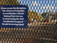 Construction crews work to build the 2025 Presidential Inaugural Parade Reviewing Stand on Pennsylvania Avenue outside of the White House in...