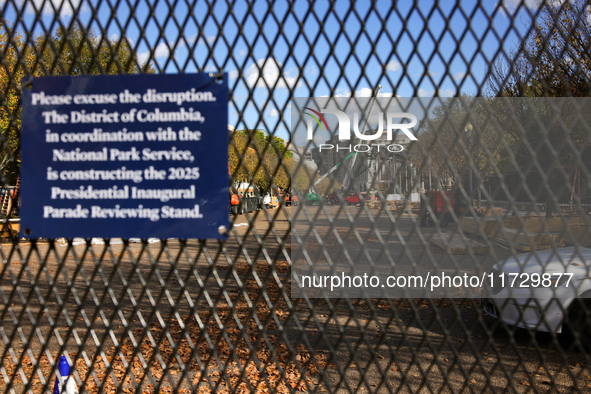 Construction crews work to build the 2025 Presidential Inaugural Parade Reviewing Stand on Pennsylvania Avenue outside of the White House in...