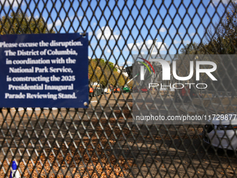 Construction crews work to build the 2025 Presidential Inaugural Parade Reviewing Stand on Pennsylvania Avenue outside of the White House in...