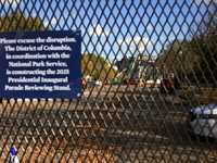 Construction crews work to build the 2025 Presidential Inaugural Parade Reviewing Stand on Pennsylvania Avenue outside of the White House in...