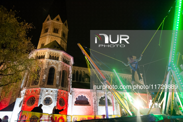 Bonner Munster, the old Catholic church, is illuminated during the ''Bonn Leuchtet'' light festival in Bonn, Germany, on November 1, 2024. 