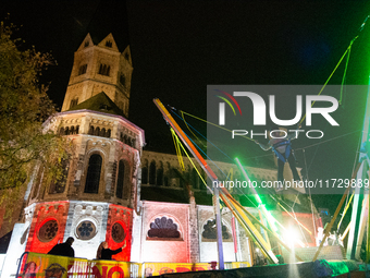 Bonner Munster, the old Catholic church, is illuminated during the ''Bonn Leuchtet'' light festival in Bonn, Germany, on November 1, 2024. (