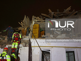 Rescuers work at a house destroyed by a Russian missile strike in Kharkiv, Ukraine, on November 1, 2024. NO USE RUSSIA. NO USE BELARUS. (