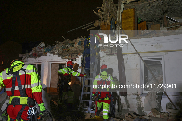 Rescuers work at a house destroyed by a Russian missile strike in Kharkiv, Ukraine, on November 1, 2024. NO USE RUSSIA. NO USE BELARUS. 