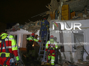 Rescuers work at a house destroyed by a Russian missile strike in Kharkiv, Ukraine, on November 1, 2024. NO USE RUSSIA. NO USE BELARUS. (