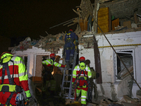 Rescuers work at a house destroyed by a Russian missile strike in Kharkiv, Ukraine, on November 1, 2024. NO USE RUSSIA. NO USE BELARUS. (