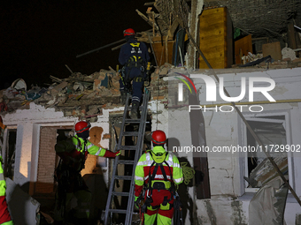 Rescuers work at a house destroyed by a Russian missile strike in Kharkiv, Ukraine, on November 1, 2024. NO USE RUSSIA. NO USE BELARUS. (