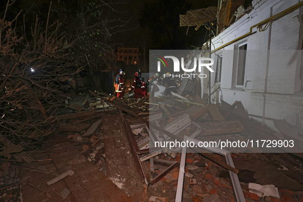 Rescuers work at a house destroyed by a Russian missile strike in Kharkiv, Ukraine, on November 1, 2024. NO USE RUSSIA. NO USE BELARUS. 