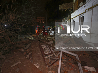 Rescuers work at a house destroyed by a Russian missile strike in Kharkiv, Ukraine, on November 1, 2024. NO USE RUSSIA. NO USE BELARUS. (