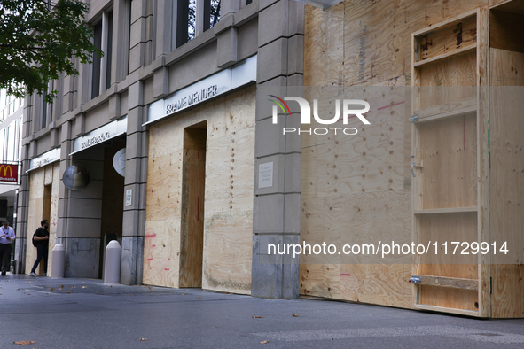 Storefronts are seen covered near the White House in Washington, D.C. on November 1, 2024 in preparation for possible civil unrest related t...