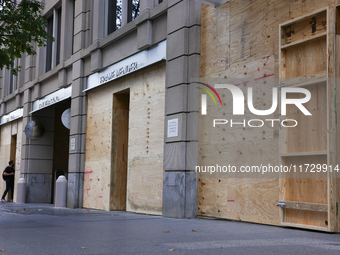 Storefronts are seen covered near the White House in Washington, D.C. on November 1, 2024 in preparation for possible civil unrest related t...