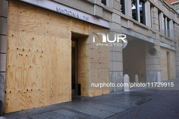 Storefronts are seen covered near the White House in Washington, D.C. on November 1, 2024 in preparation for possible civil unrest related t...