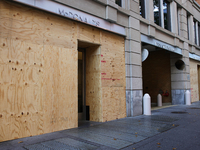 Storefronts are seen covered near the White House in Washington, D.C. on November 1, 2024 in preparation for possible civil unrest related t...