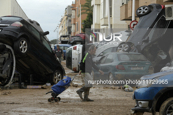 A view of the disaster area as search and rescue operations and aid delivery continue in Paiporta following the floods caused by heavy rain...