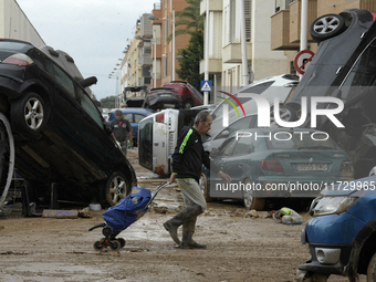 A view of the disaster area as search and rescue operations and aid delivery continue in Paiporta following the floods caused by heavy rain...