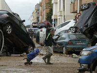 A view of the disaster area as search and rescue operations and aid delivery continue in Paiporta following the floods caused by heavy rain...