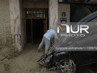 A view of the disaster area as search and rescue operations and aid delivery continue in Paiporta following the floods caused by heavy rain...