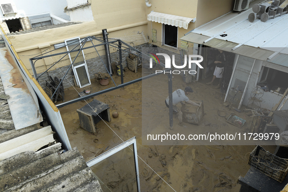 A view of the disaster area as search and rescue operations and aid delivery continue in Paiporta following the floods caused by heavy rain...