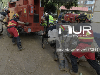 A view of the disaster area as search and rescue operations and aid delivery continue in Paiporta following the floods caused by heavy rain...