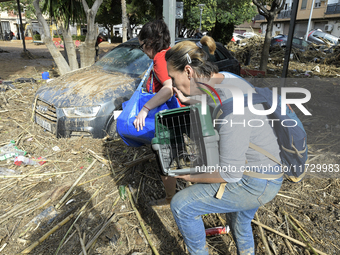 A view of the disaster area as search and rescue operations and aid delivery continue in Paiporta following the floods caused by heavy rain...