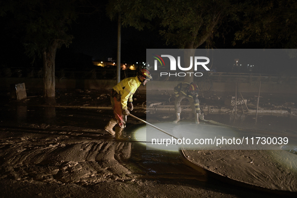 Emergency personnel work in a flooded area after heavy rains cause flooding in Uriel, Valencia, Spain, on November 1, 2024. 