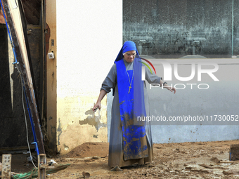 People clear mud and possessions from their homes after flash flooding in Paiporta, Spain, on November 1, 2024. (