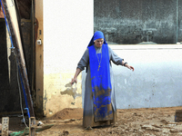 People clear mud and possessions from their homes after flash flooding in Paiporta, Spain, on November 1, 2024. (