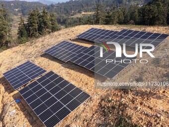 An aerial photo on November 1, 2024, shows the Qiuli photovoltaic distributed power station in Xijiang town, Congjiang county, Guizhou provi...