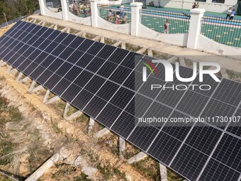 An aerial photo on November 1, 2024, shows the Qiuli photovoltaic distributed power station in Xijiang town, Congjiang county, Guizhou provi...