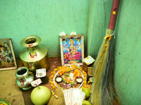 A Nepalese devotee offers a ritual prayer towards a poster of Laxmi Puja during the procession of Tihar or Deepawali and Diwali celebrations...