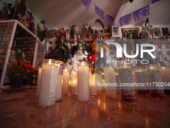 An image of Santa Muerte is seen inside the temple in the municipality of Pedro Escobedo during the annual celebrations. Every year on Novem...