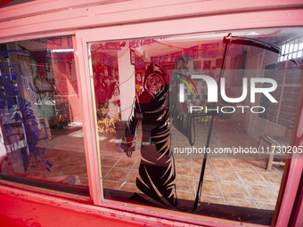 An image of Santa Muerte is seen inside the temple in the municipality of Pedro Escobedo during the annual celebrations. Every year on Novem...