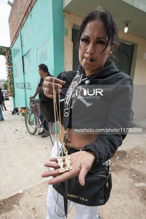 A faithful attends the temple of Santa Muerte in the municipality of Pedro Escobedo, Mexico, on November 1, 2024, to worship her and give th...