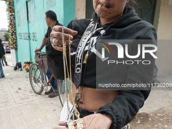 A faithful attends the temple of Santa Muerte in the municipality of Pedro Escobedo, Mexico, on November 1, 2024, to worship her and give th...