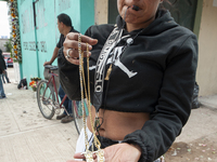 A faithful attends the temple of Santa Muerte in the municipality of Pedro Escobedo, Mexico, on November 1, 2024, to worship her and give th...